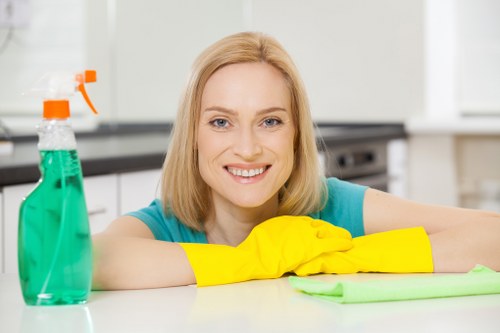 Cleaning technician preparing materials and confirming service details